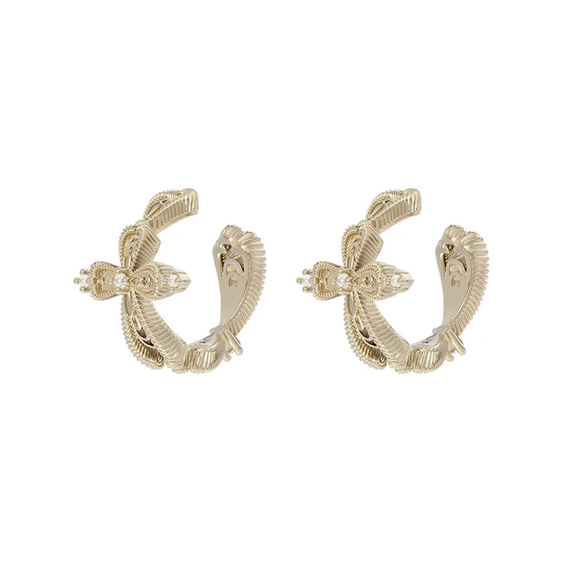 Elegant SUN HUNTER lace cross earrings in gold featuring intricate detailing for a chic look