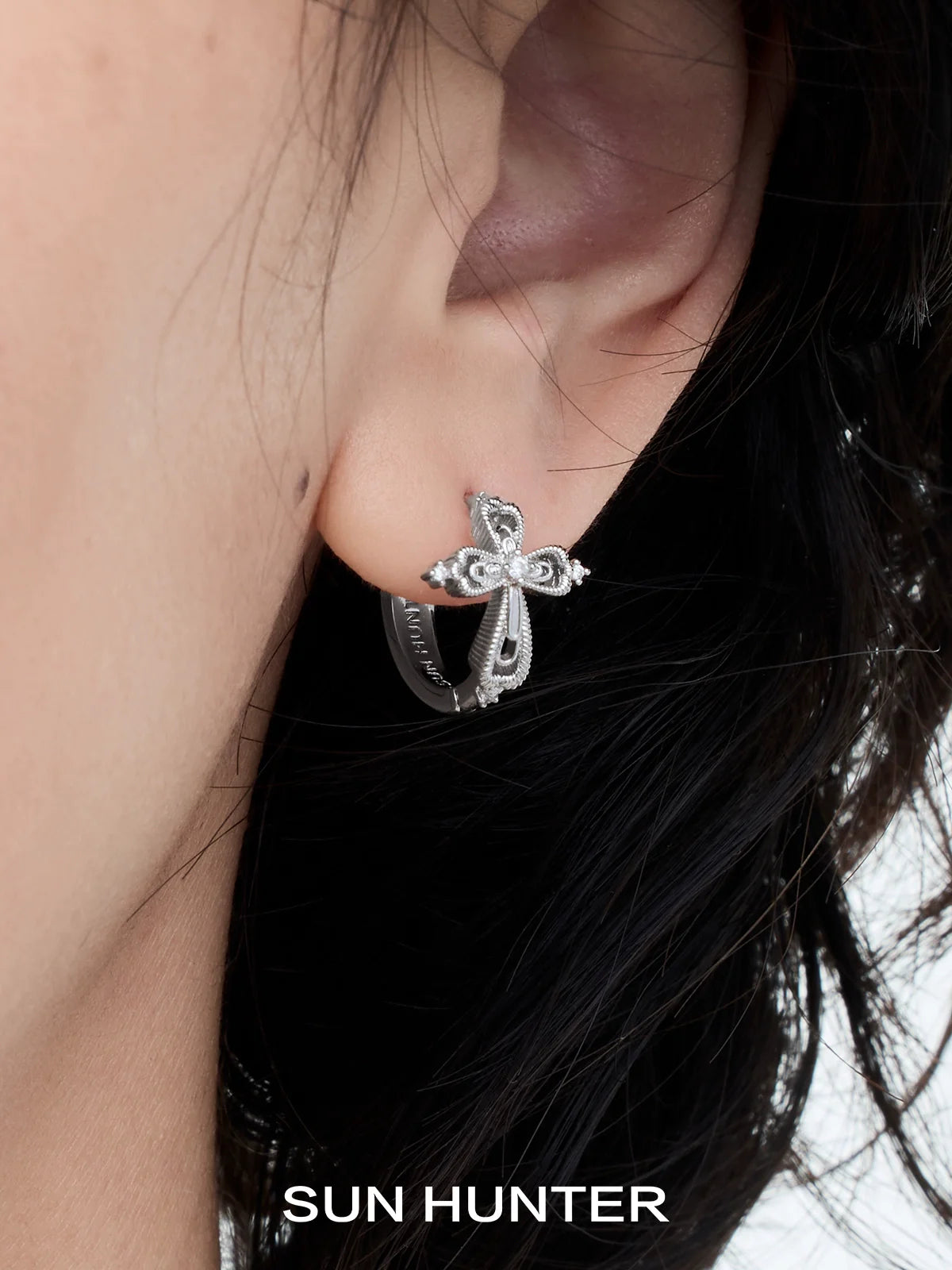SUN HUNTER lace cross earrings featuring an elegant design in silver for a stylish look