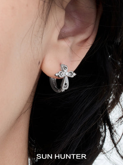 SUN HUNTER lace cross earrings featuring an elegant design in silver for a stylish look