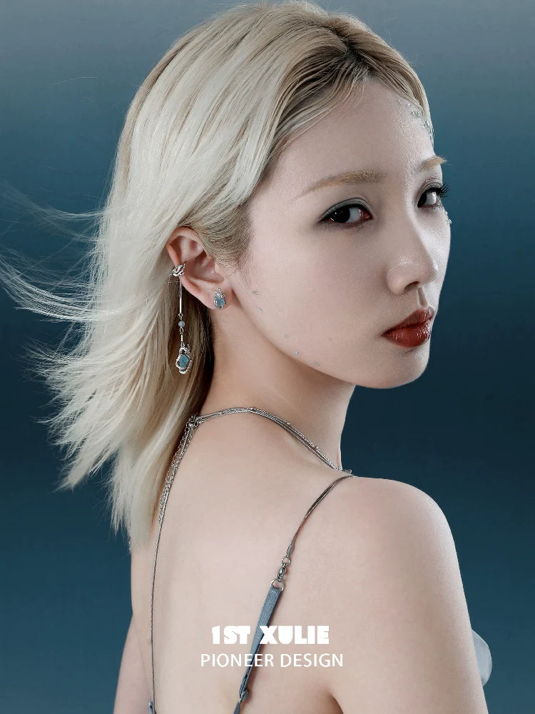 Elegant lake elf ear cuffs displayed on a model with flowing hair against a soft background