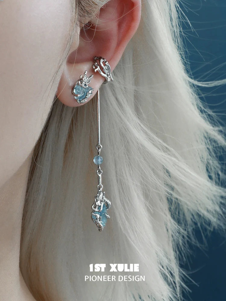 Lake elf ear cuffs in silver with dangling accents and blue gemstones for a whimsical look