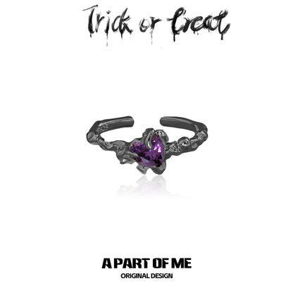 A PART OF ME little demon goth ring with a purple heart-shaped gemstone and intricate design