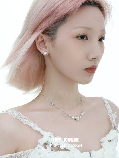 Elegant woman wearing a love fritillary silver necklace with delicate design and shimmering accents