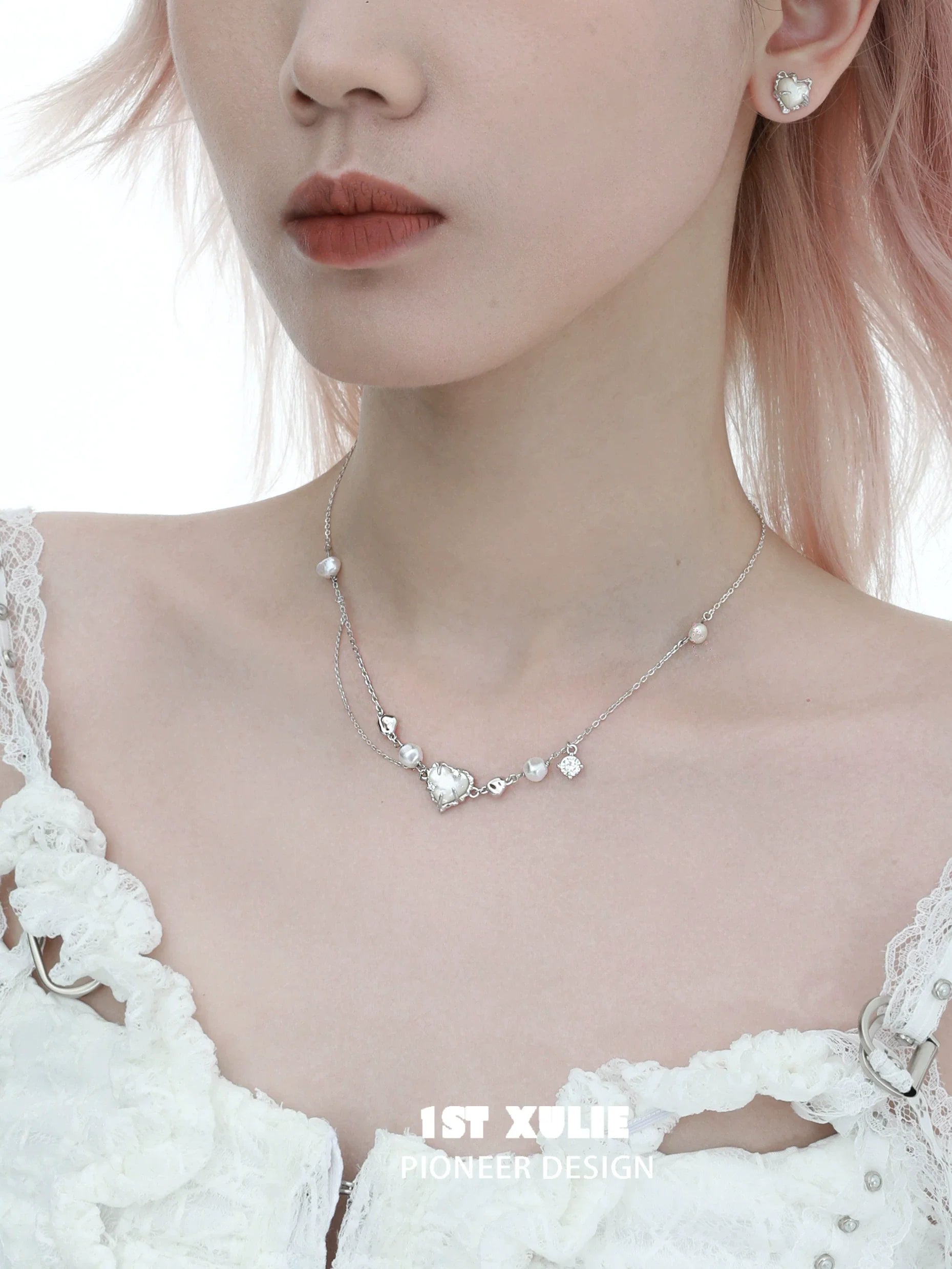 Love fritillary silver necklace featuring elegant heart and pearl accents for a chic look