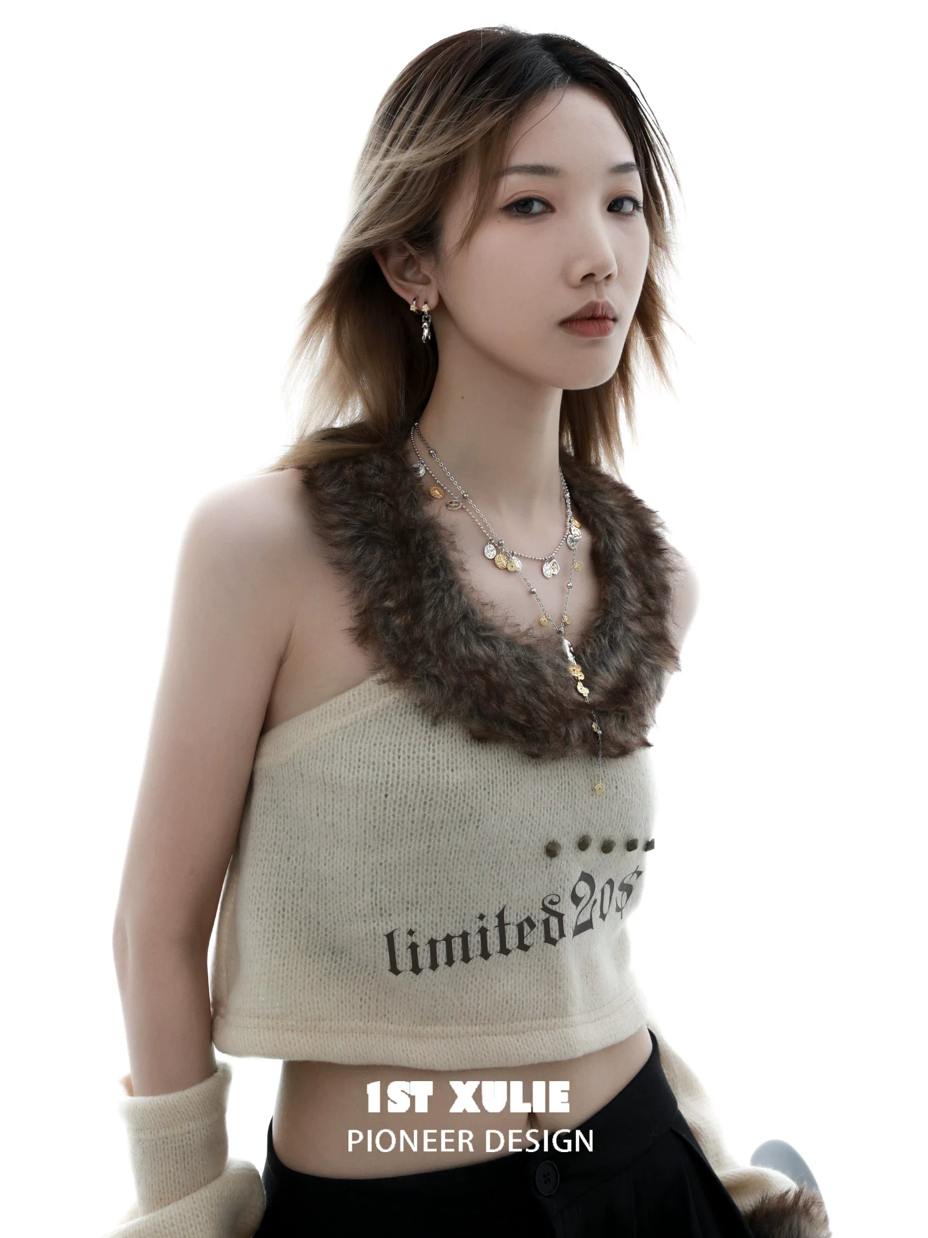 Model wearing a stylish lucky cat charm necklace paired with a trendy cropped sweater