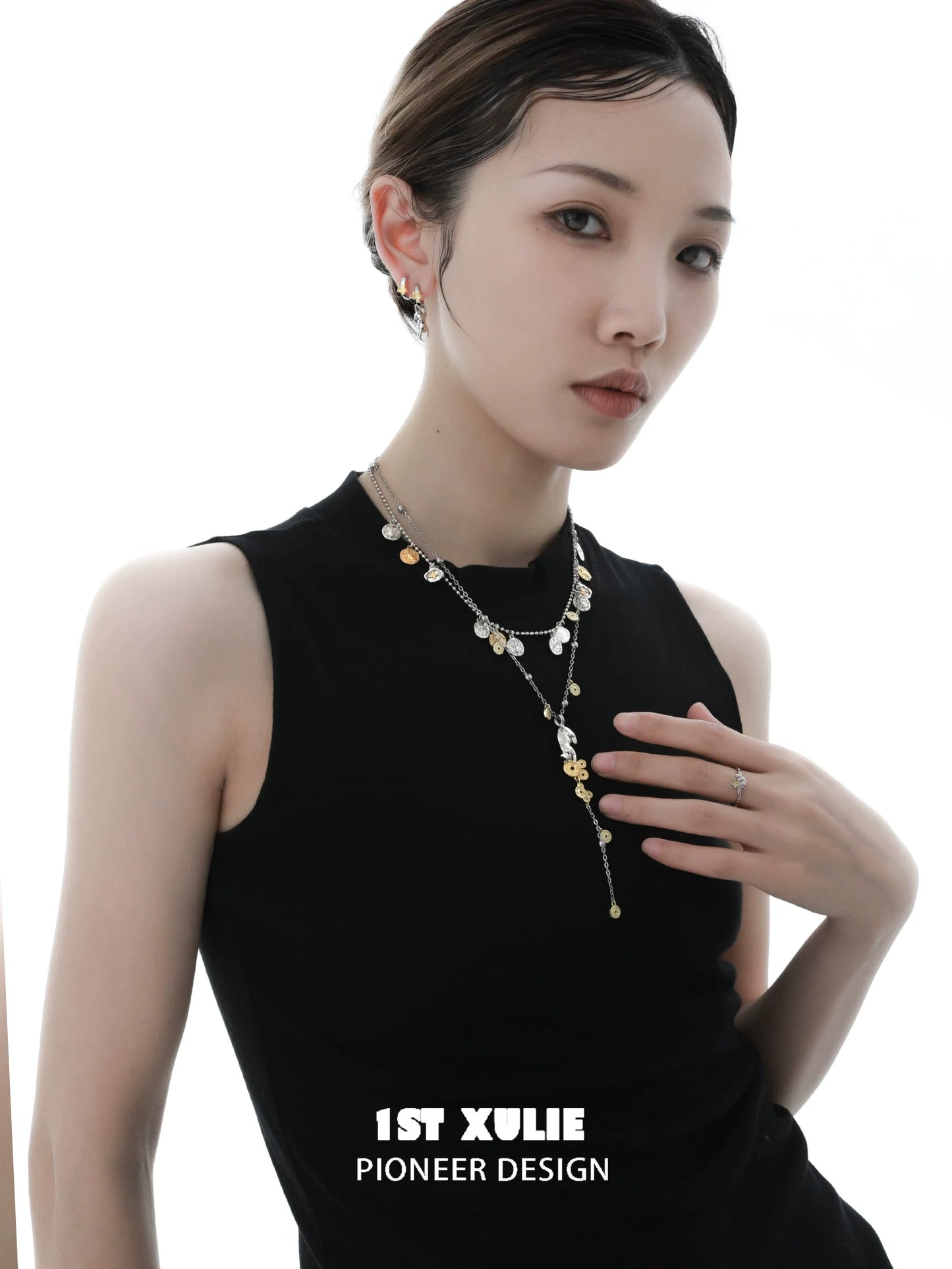 Stylish model wearing a lucky cat charm necklace with gold accents and layered design