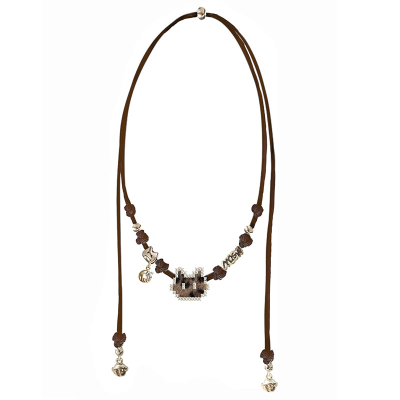 MASW jewelry mosaic pixel cat necklace from Gothhalo Jewelry on a brown cord with silver accents