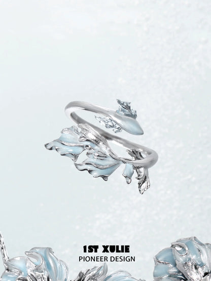 Mermaid tail silver ring featuring intricate wave designs and a polished finish