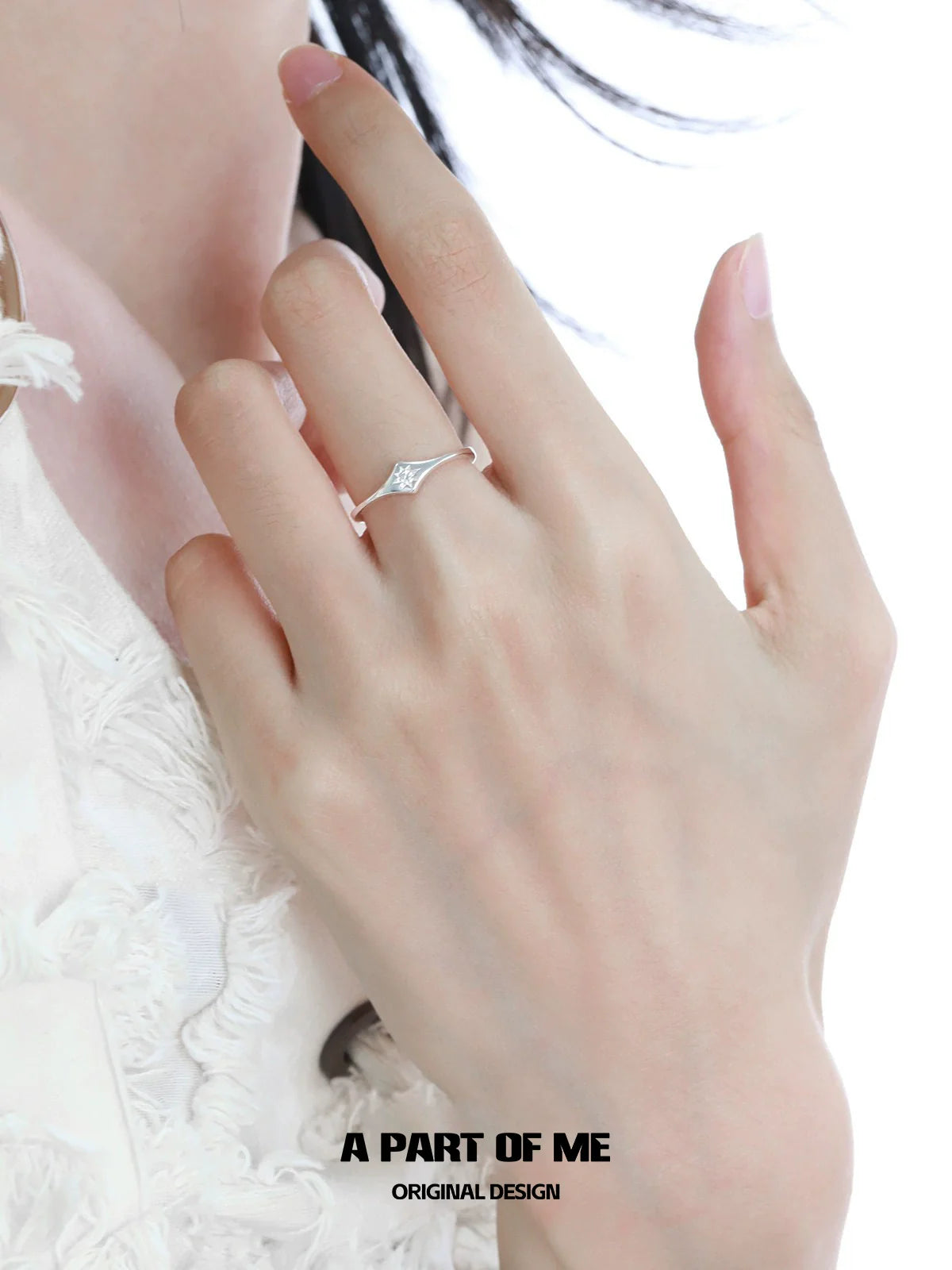 Delicate minimalist lotus silver ring showcased on a hand with a stylish outfit