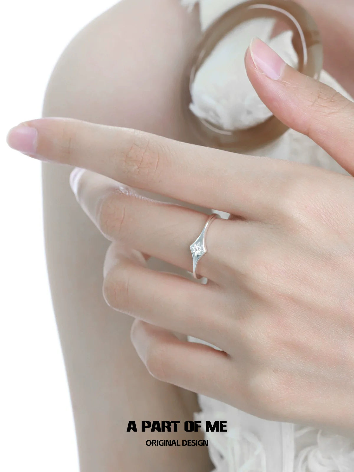 A PART OF ME minimalist lotus silver ring elegantly showcased on a hand with delicate fingers