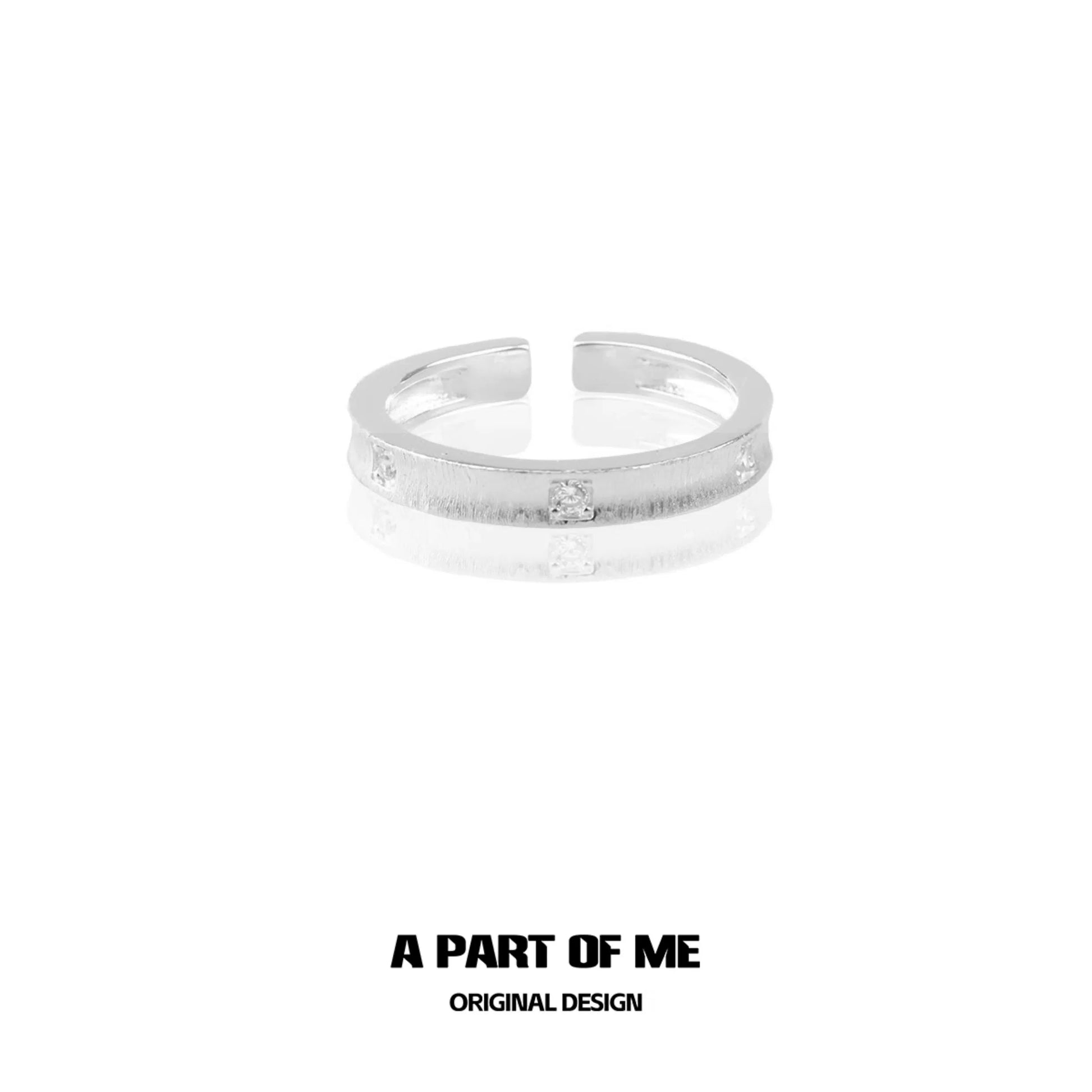 Minimalist silver ring with a sleek design and subtle sparkle for a modern look