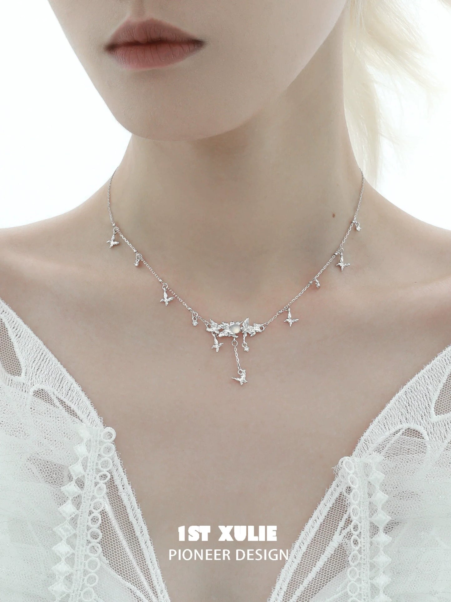 Mint butterfly necklace from 1STXULIE featuring delicate silver butterfly charms for a chic look