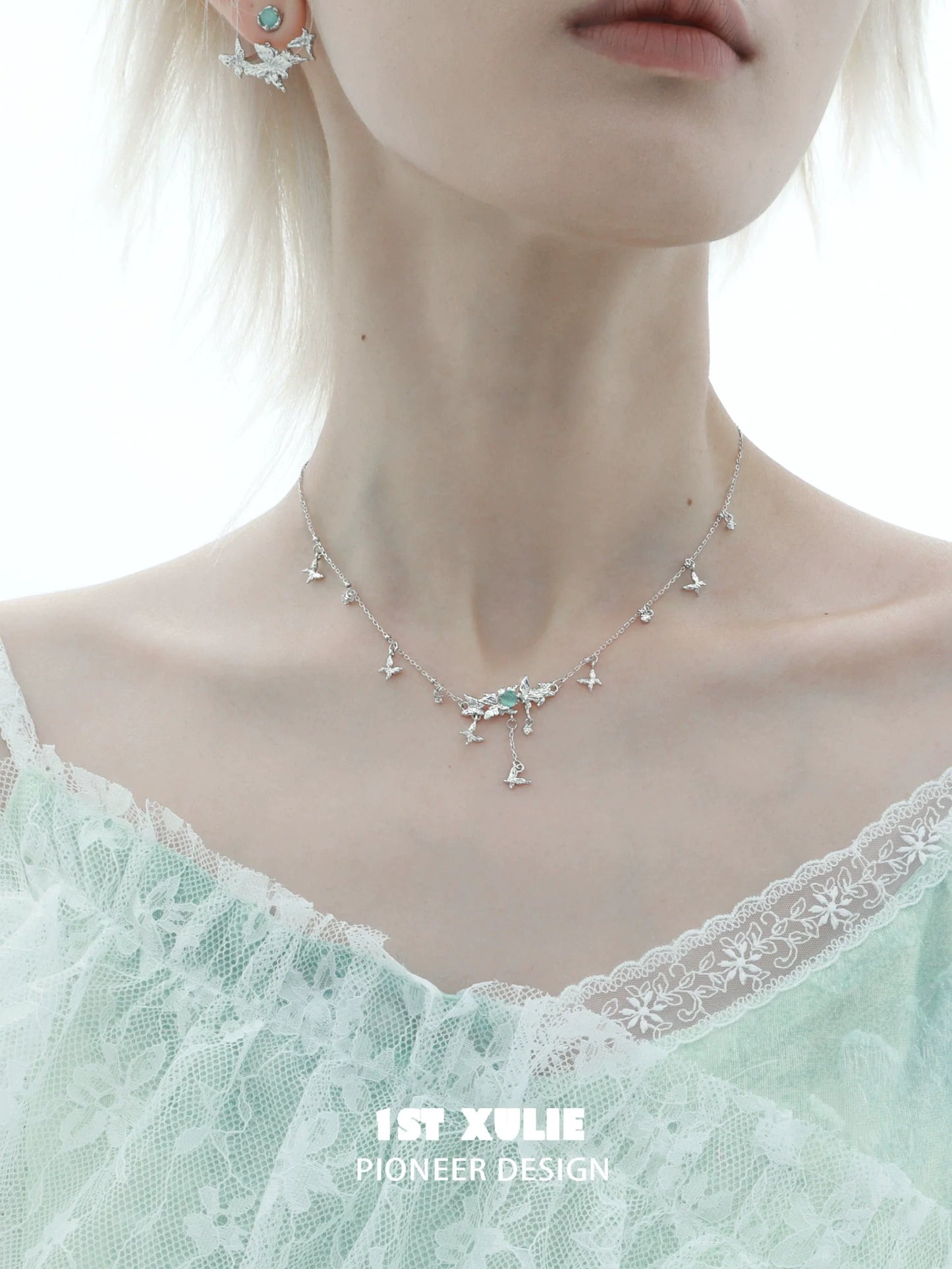 Mint butterfly necklace with delicate design, featuring sparkling accents for an elegant look