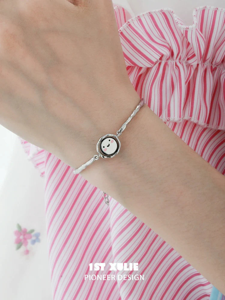 Stylish 1STXULIE mood diary bangle with a cute smiling face charm for daily expression