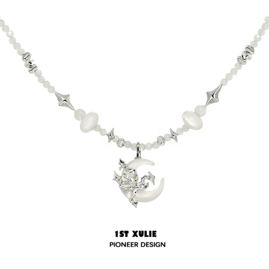 Moon beaded clavicle chain necklace featuring silver and white beads with a crescent moon charm
