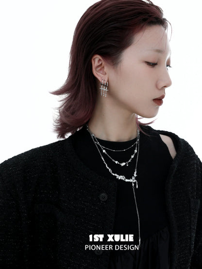 Model wearing layered silver jewelry featuring a moonlight fragment silver necklace for a stylish look