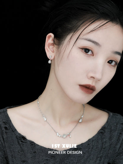 Stylish model wearing moonlit agate earrings with a sophisticated design for elegant occasions