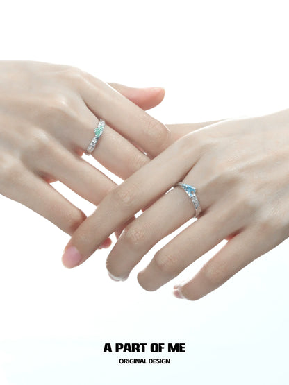 A PART OF ME mountain and sea couple rings featuring elegant designs on intertwined hands