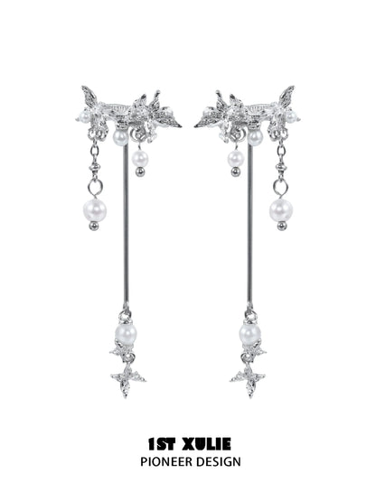 Elegant mystic butterfly ear clips with dangling pearls and intricate design from 1STXULIE