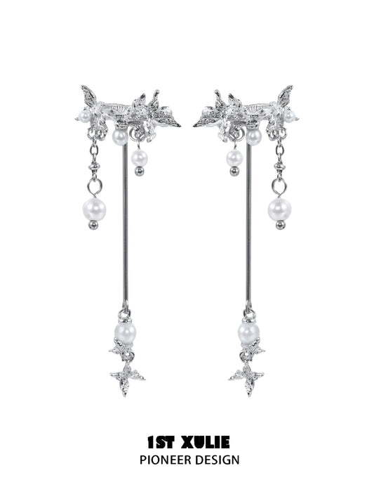 Elegant mystic butterfly ear clips with dangling pearls and intricate design from 1STXULIE