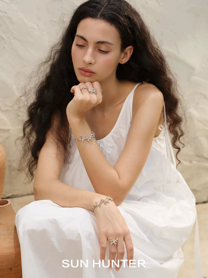 Model wearing a SUN HUNTER mystic butterfly ring with elegant styling for a chic look