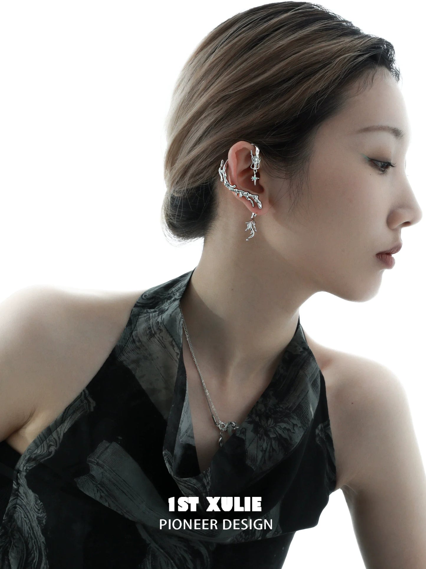 Stylish mystic dragon ear studs showcased on a model with elegant hairstyle and outfit