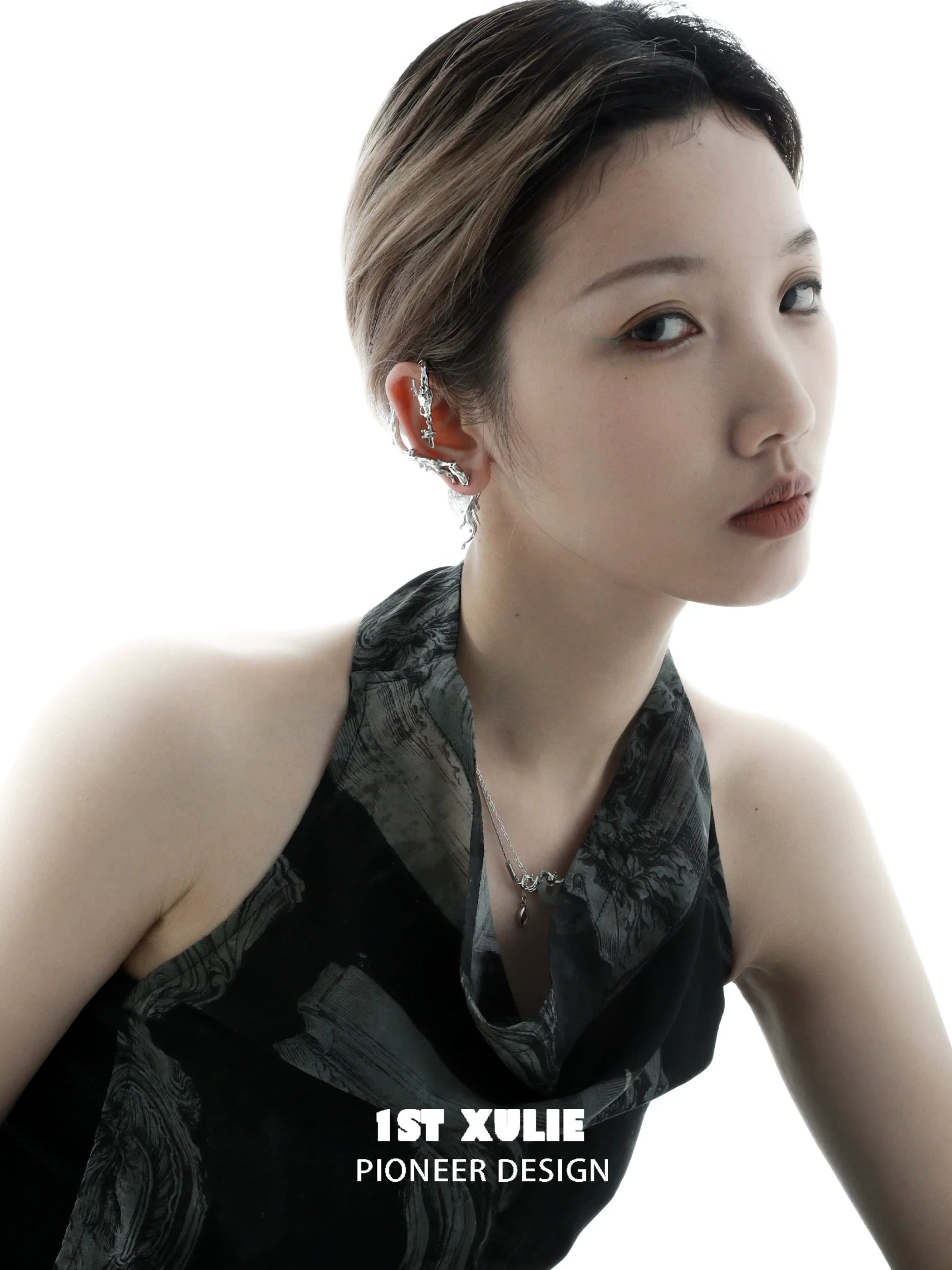 Elegant model showcasing Mystic Dragon Ear Studs with intricate design and shimmering details
