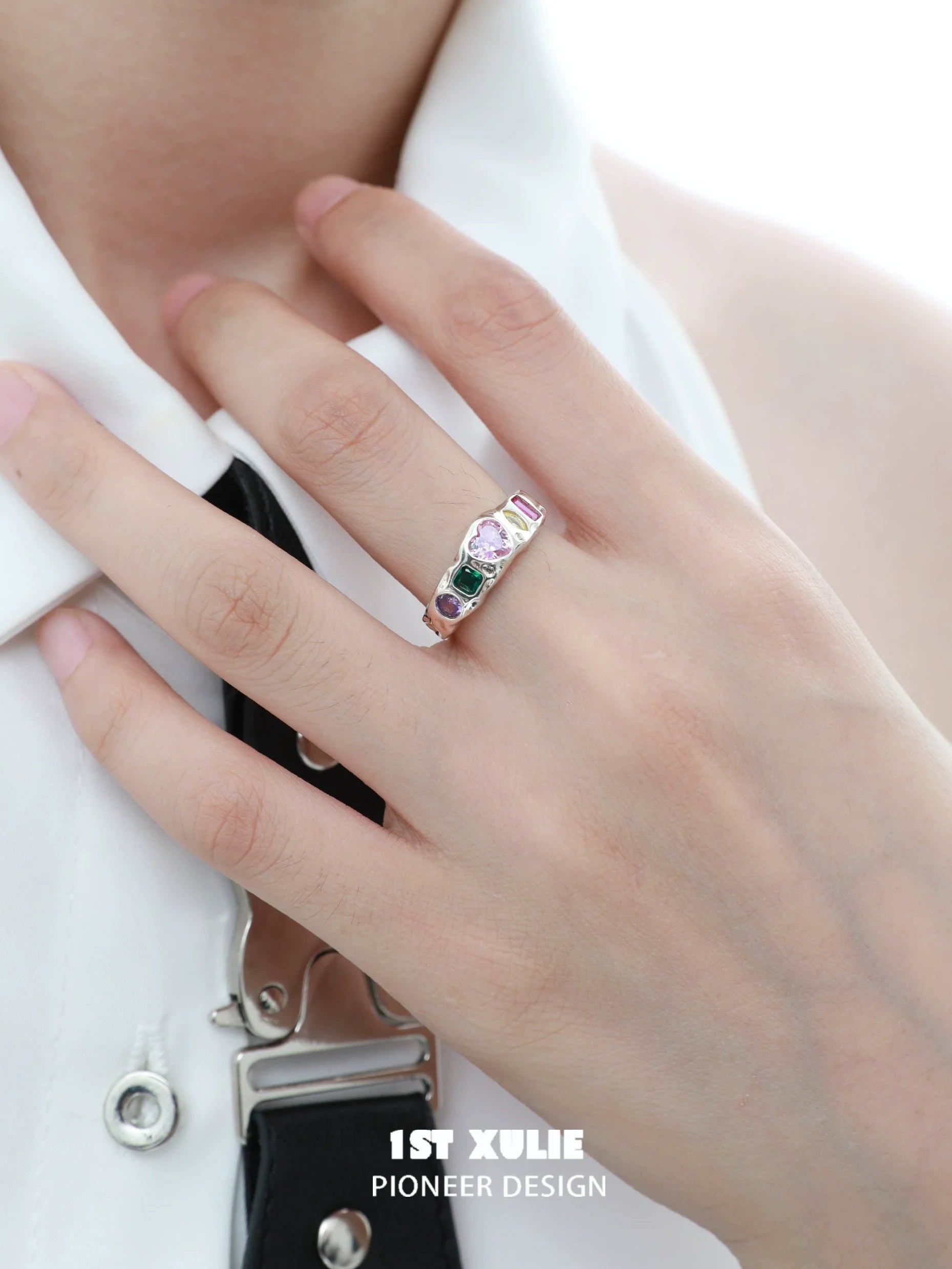 Elegant mystic heart zircon silver ring showcased on a model's hand for stylish accessory presentation