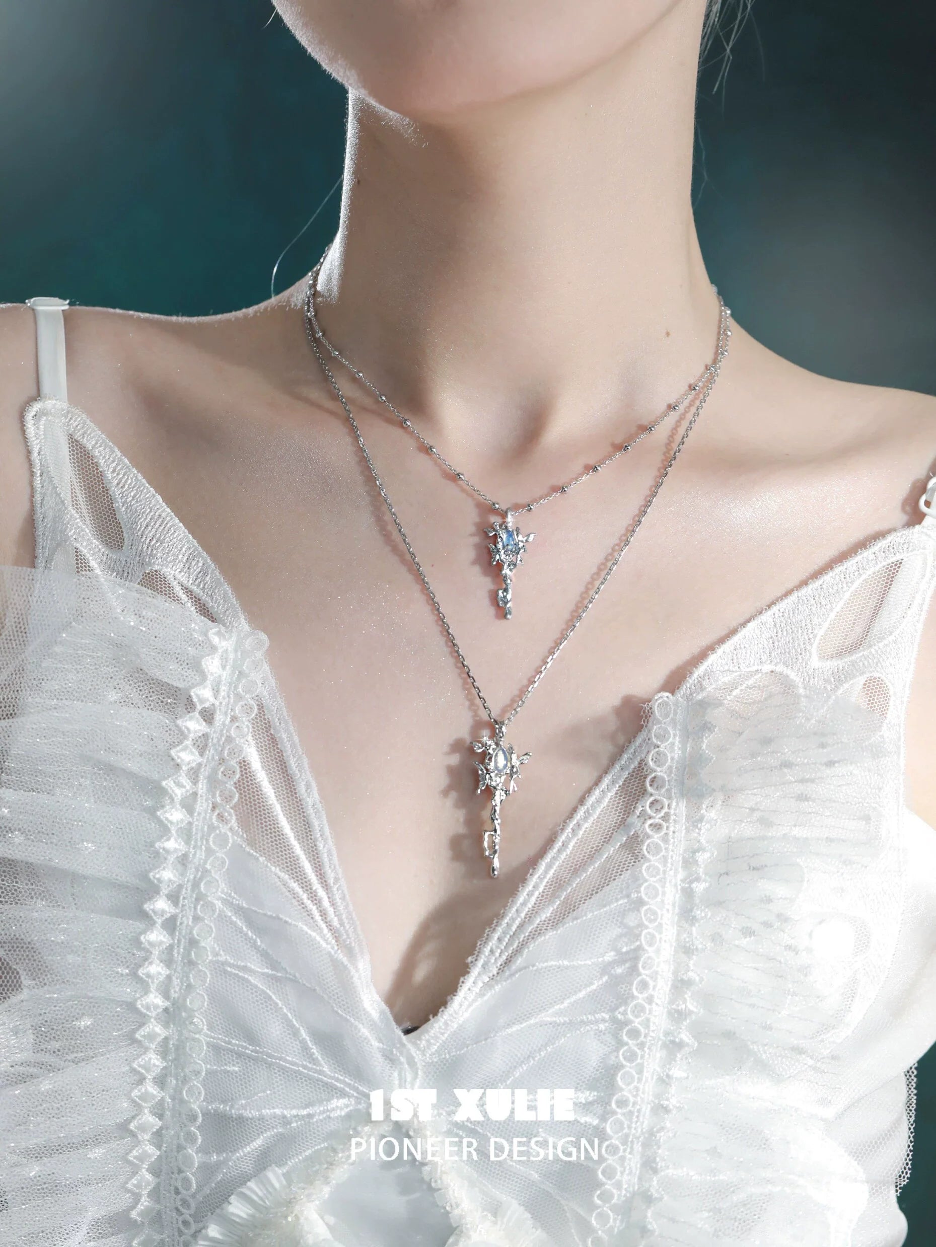 Elegant model wearing a mystic sprite necklace layered with intricate silver design