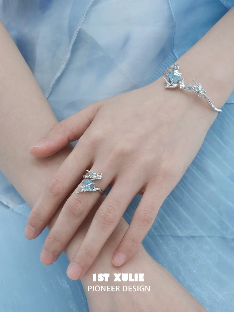 Elegant ocean dragon king sapphire bracelet showcased on a model's wrist, complemented by a matching ring