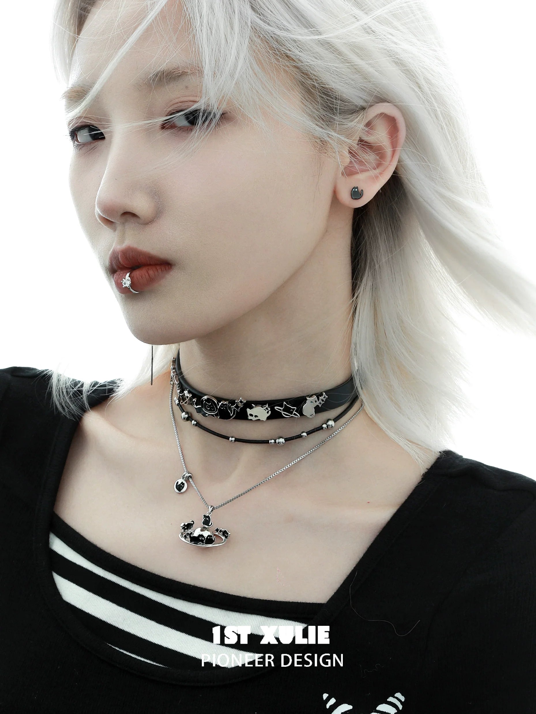 Owl leather necklace shown on a model with silver accents and layered chokers for a stylish look