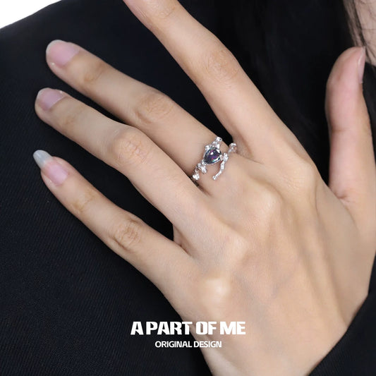 Amethyst silver vine ring featuring elegant design with sparkling accents on a model's hand