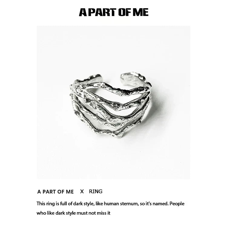 Bone minimalist ring from A PART OF ME featuring a dark, textured design resembling human sternum