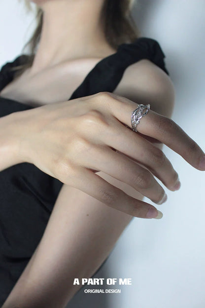Elegant irregular silver ring showcased on a hand, designed by A PART OF ME