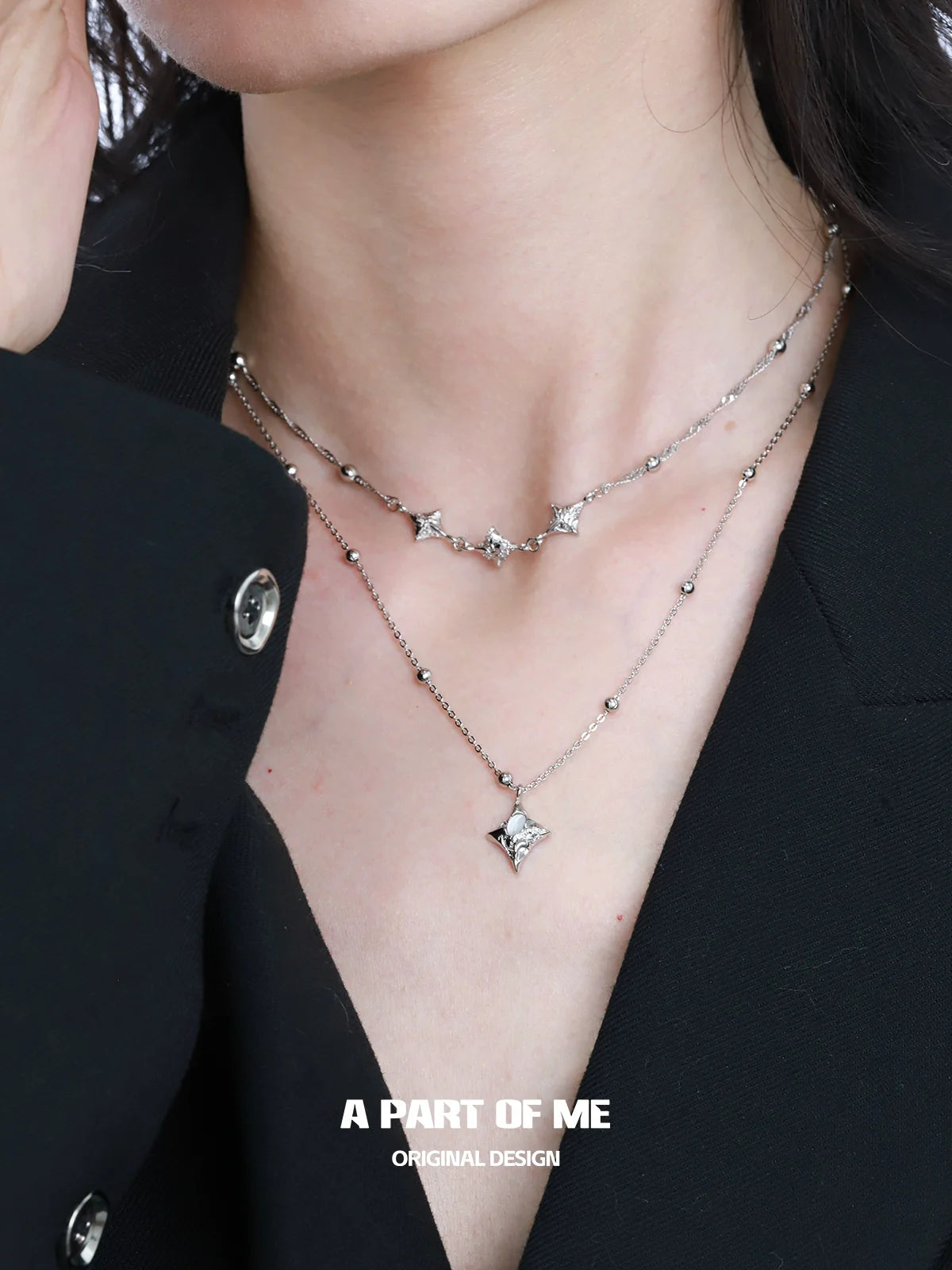 Layered silver necklace with starlight planet charms from A PART OF ME for a stylish look