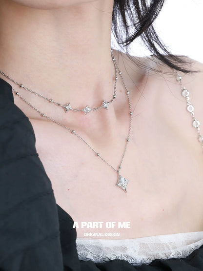 Layered A PART OF ME starlight planet silver necklace featuring sparkling star-shaped pendants