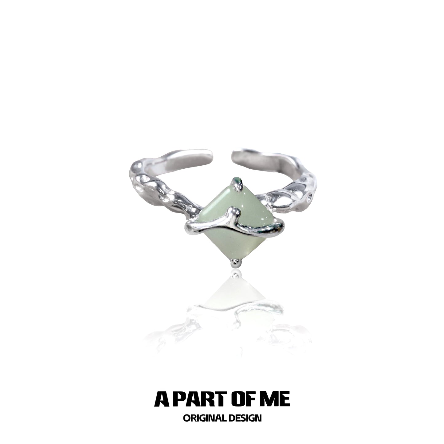 Unique silver gothic ring featuring a green gemstone in an intricate design from A PART OF ME