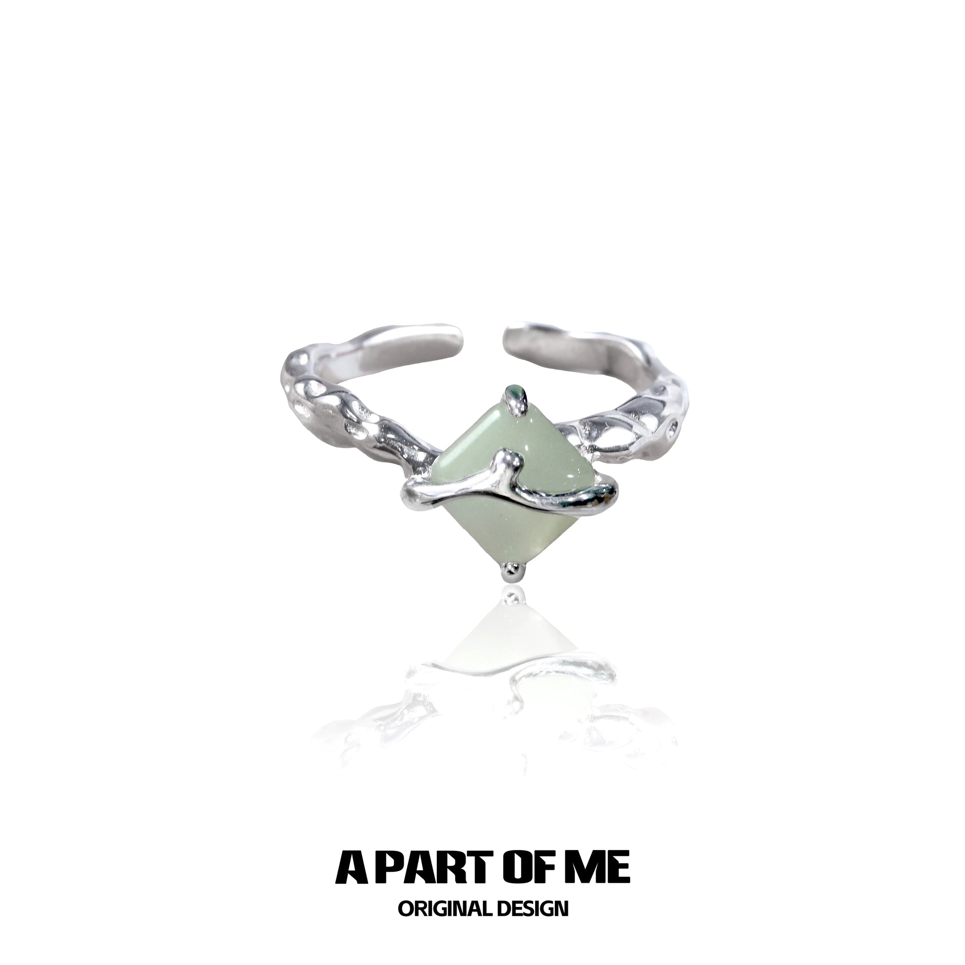 Unique silver gothic ring featuring a green gemstone in an intricate design from A PART OF ME