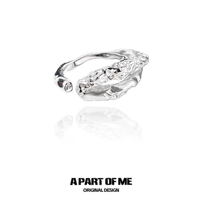 Unique symbiosis ring in silver featuring an intricate design with a polished finish