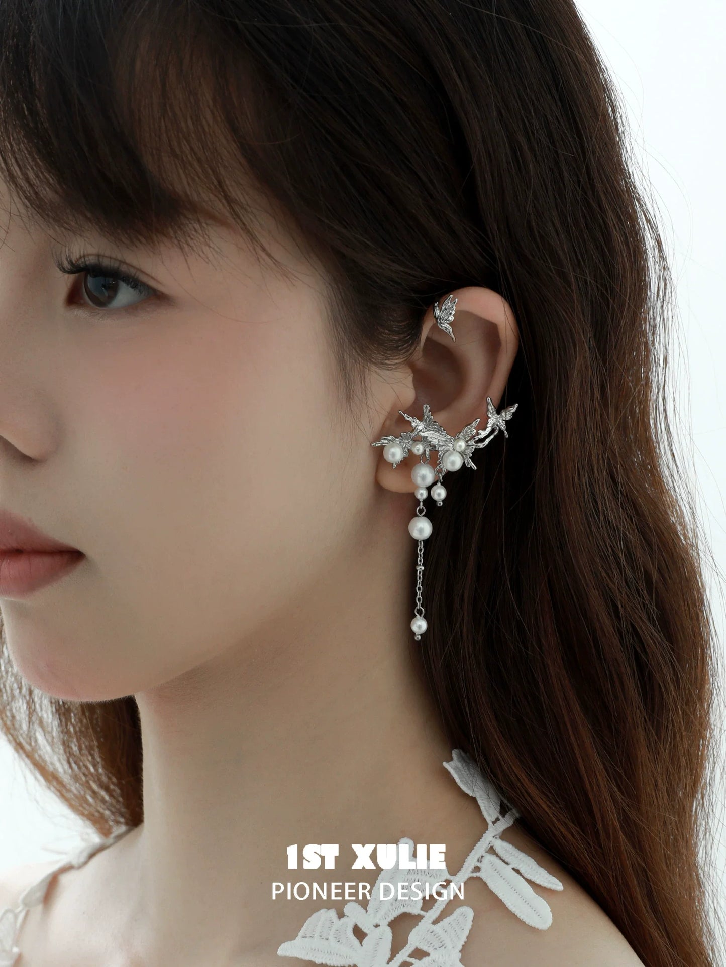 Elegant pearl butterfly ear cuffs with delicate design, perfect for stylish accessories
