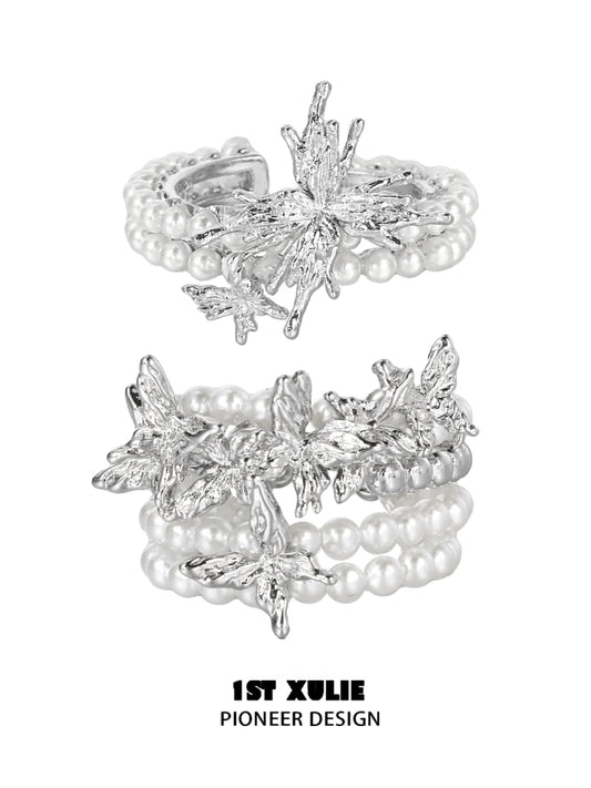 Elegant pearl butterfly ring with silver detailing and multiple pearl strands for a vintage look