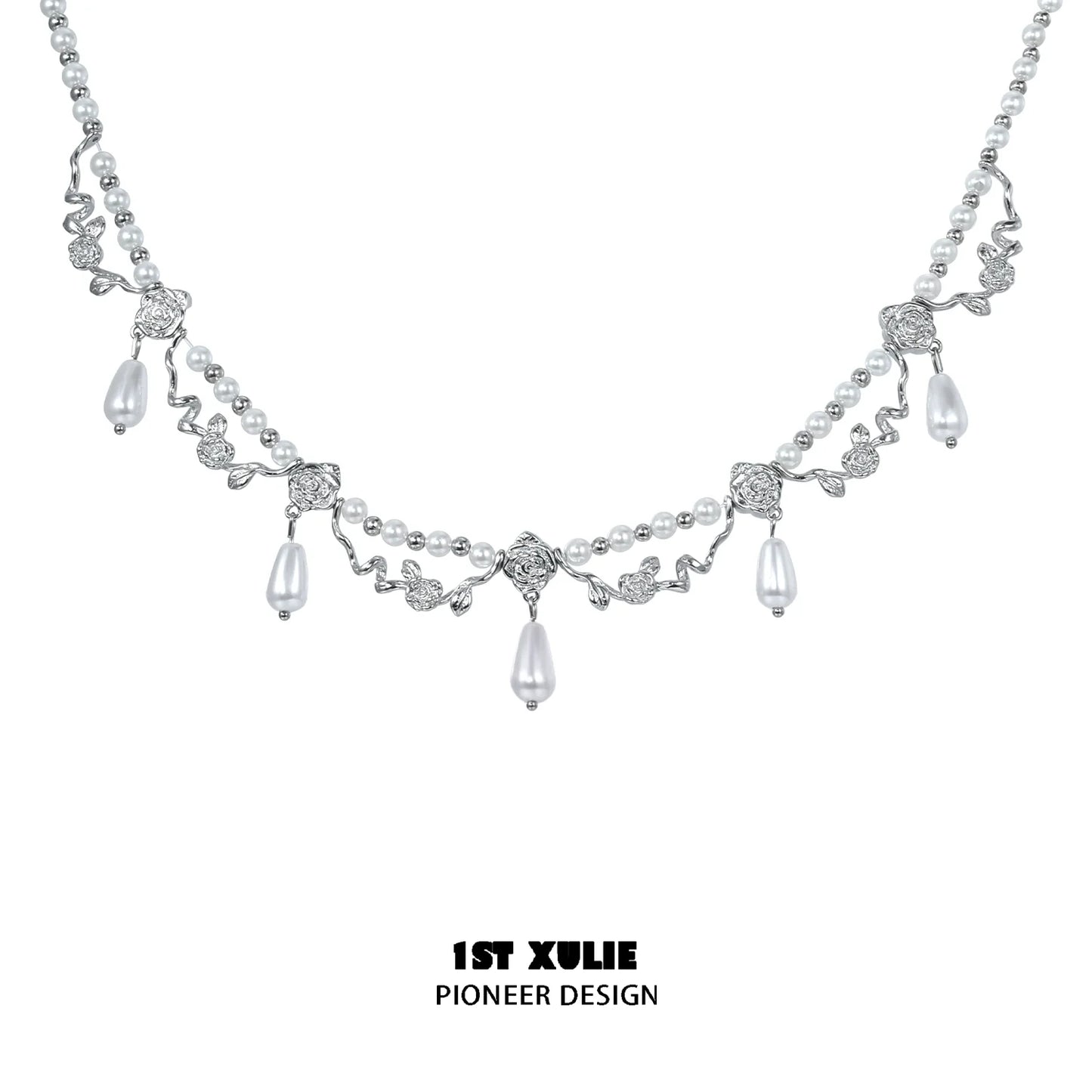 Elegant silver pearl clavicle necklace with intricate leaf design and dangling pearls