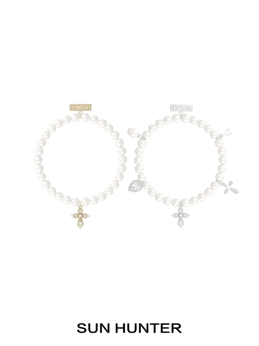 SUN HUNTER pearl cross bracelet featuring elegant pearls and a stylish cross charm