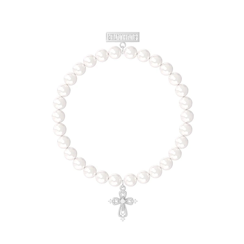Elegant pearl cross bracelet featuring white pearls and a silver cross charm for stylish expression