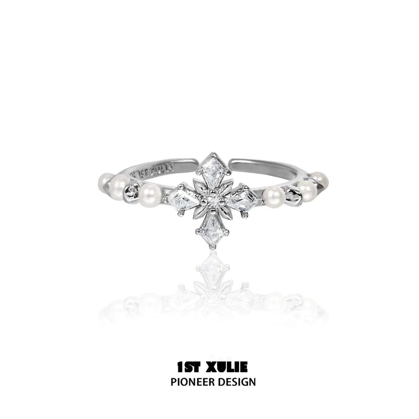 Elegant pearl cross silver ring featuring a unique design with sparkling details