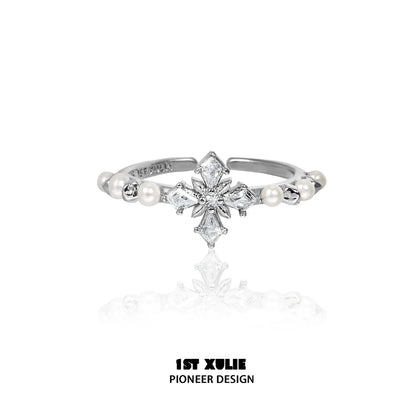 Elegant pearl cross silver ring featuring a unique design with sparkling details