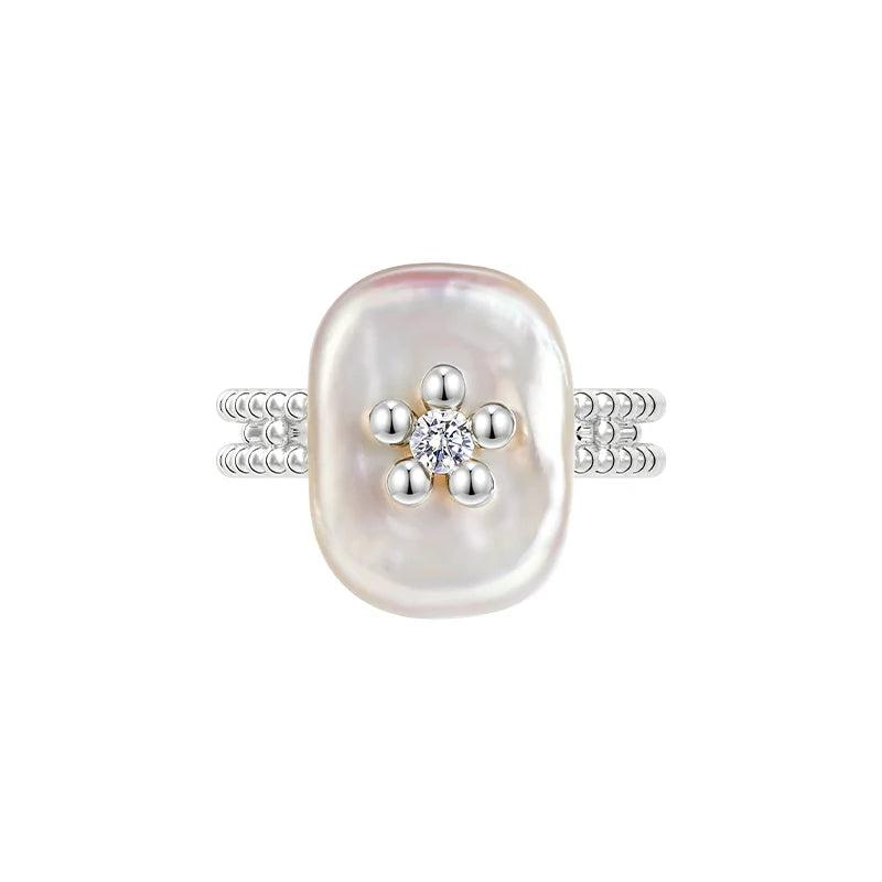 SUN HUNTER Pearl Riddle Rings with a unique oval pearl and sparkling diamond accents