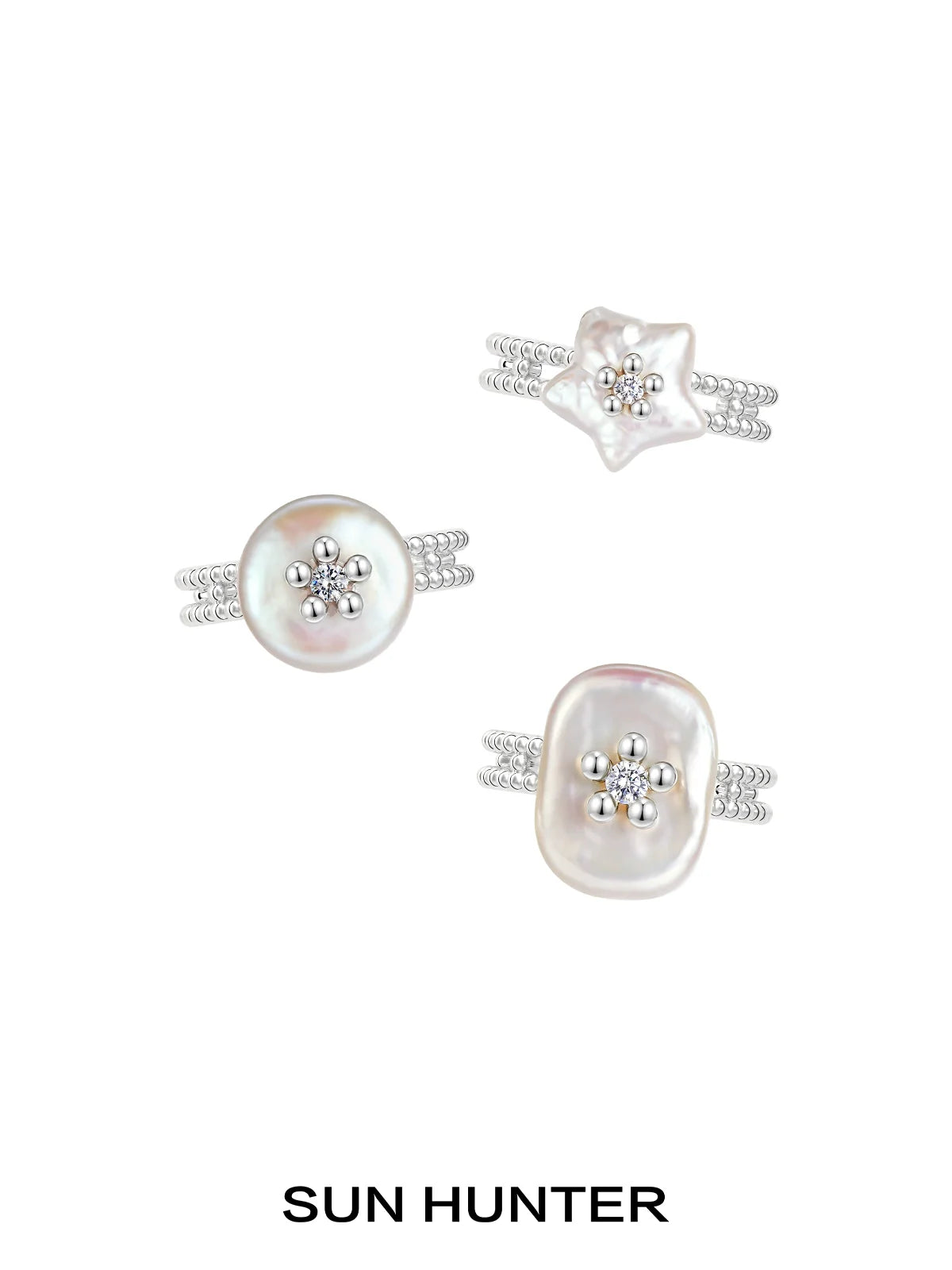 Set of three SUN HUNTER pearl riddle rings featuring unique floral designs and shimmering pearls
