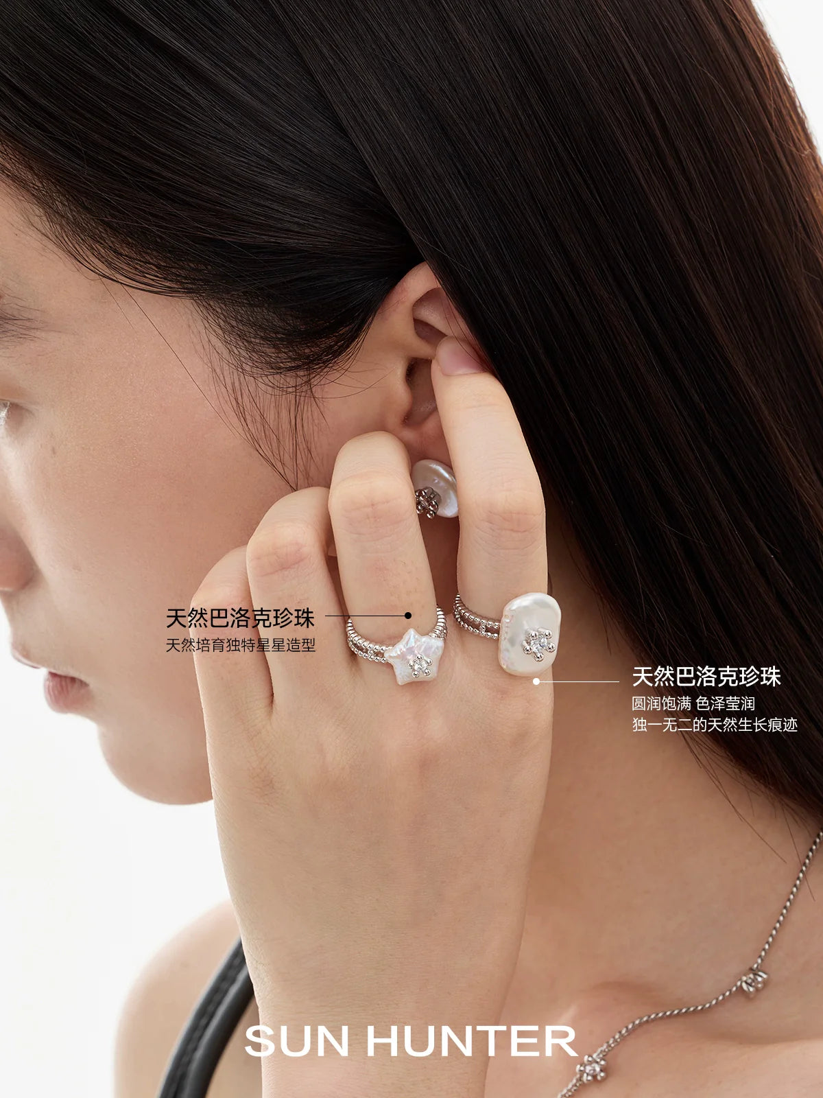 Elegant SUN HUNTER pearl riddle rings showcased on a model's fingers for a chic look