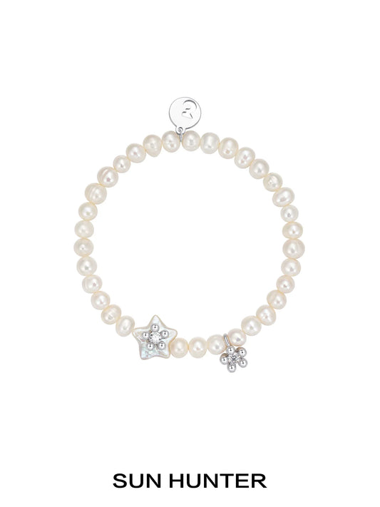 SUN HUNTER pearl star bracelet with natural pearls and star charms for elegant jewelry styling